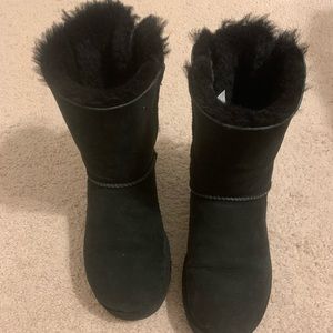 Womens UGG boots. Black with bows up the back in a size 8.